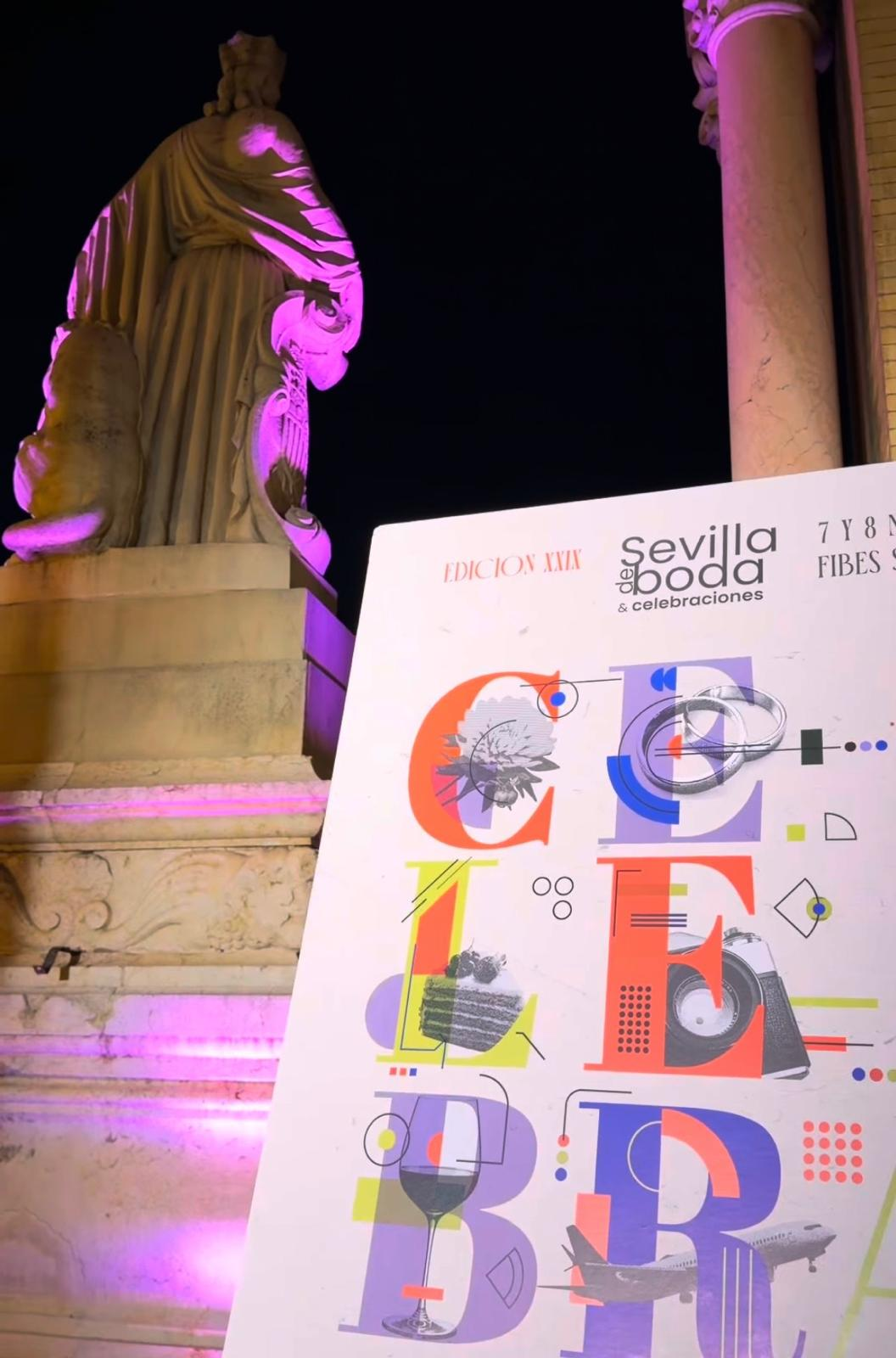 Cartel de la edición XXIX de Sevilla de Boda y Celebraciones junto a una escultura iluminada